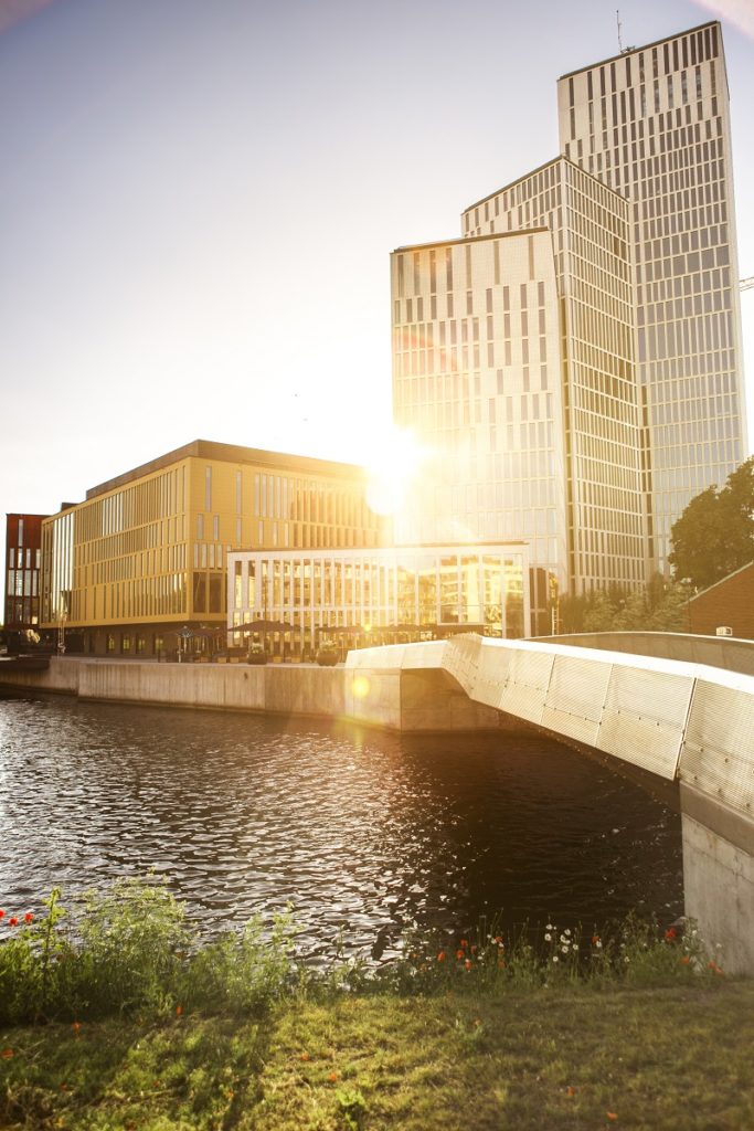 Exterior of modern buildings by canal